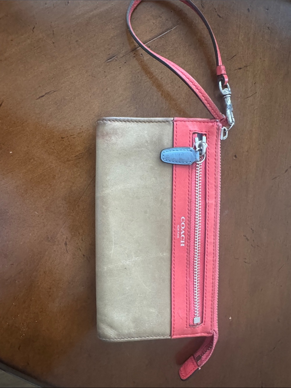 COACH Tan Wristlet with Coral Accents